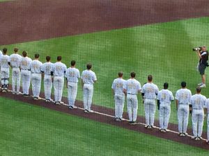 Vanderbilt teammates leave a space in their line for their fallen teammate, Donny Everett.